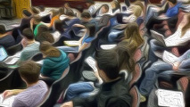 A distorted image of students sitting in seats in a lecture hall